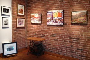 Paintings in gallery corner